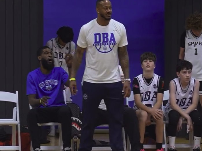 DBA coaching staff with players